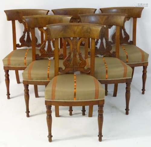 A set of six mahogany Scandinavian dining chairs with