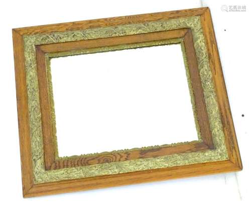 An early / mid 20thC bevelled oak mirror with