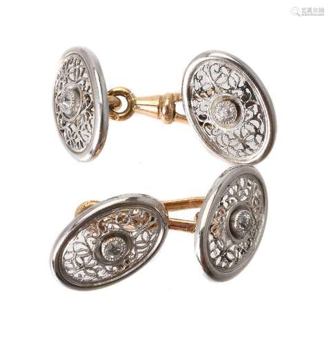 A pair of early 20th century diamond two colour cufflinks