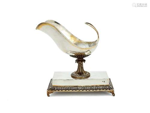 A late 18th century Austrian silver gilt sauce boat on an integral stand