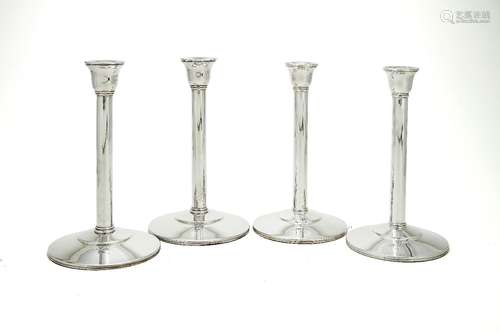 Two pairs of plain silver candlesticks by Theo Fennell