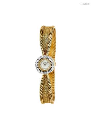 Jaeger LeCoultre, a lady's gold coloured and diamond bracelet watch