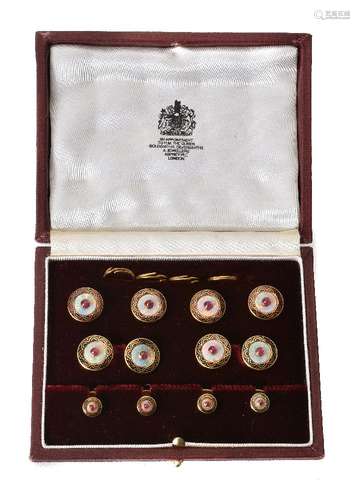 An 18 carat gold opal and ruby dress set by Asprey