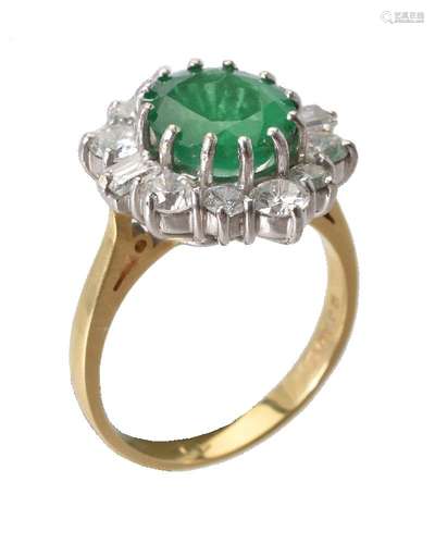 An emerald and diamond cluster ring