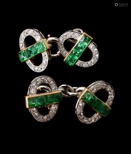 A pair of early 20th century diamond and emerald sleeve links signed Cartier Paris