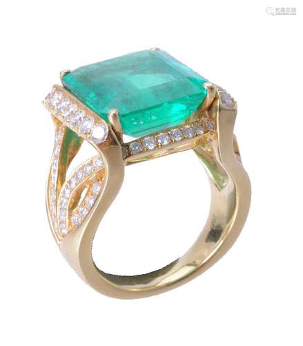 An emerald and diamond dress ring