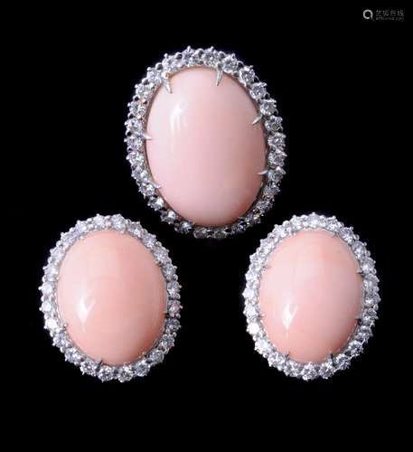 ϒ A diamond and coral dress ring and ear clips by Piaget