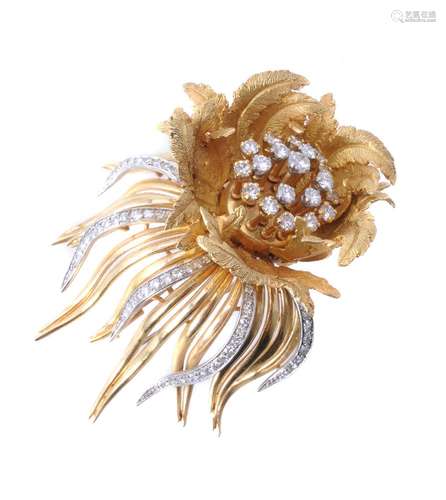 A diamond en tremblant flower brooch