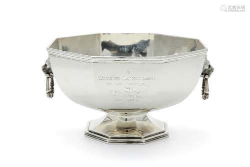 A silver octagonal pedestal punch bowl by The Goldsmiths & Silversmiths Co. Ltd