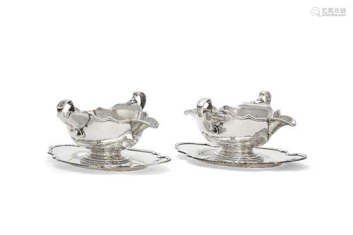 A pair of silver shaped oval sauce boats and stands by S. J. Phillips Ltd