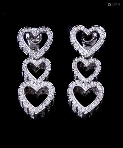 A pair of diamond triple heart ear pendants