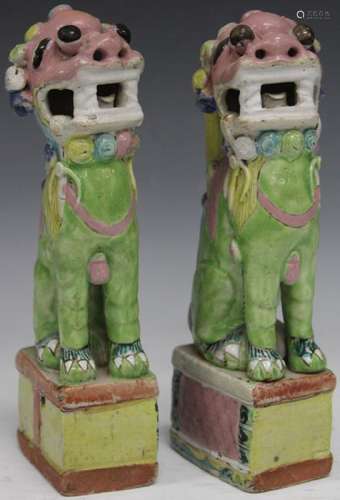 PAIR OF CHINESE POTTERY FOO LIONS, 9