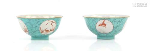 A pair of turquoise blue ground, Chinese bowls; each one decorated with orange and grisaille