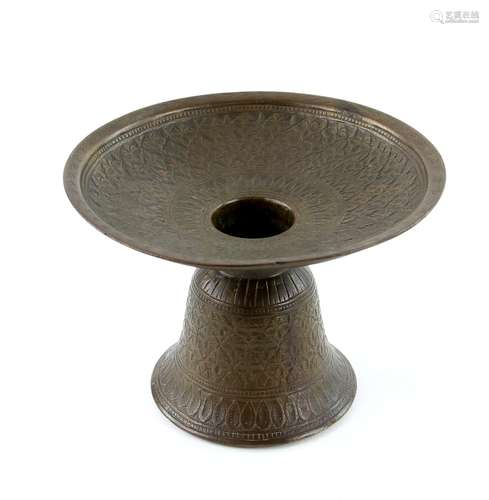 An 18th century Mughal brass spittoon for use with a betel nut set; with bell-shaped base and