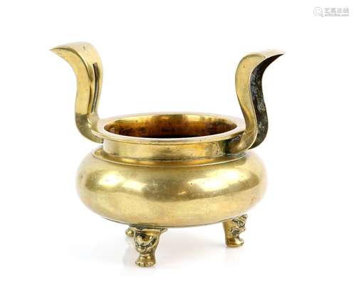 A gilded metal Ding or Incense Burner with circular rim, tripod animal mask feet and curved, pierced