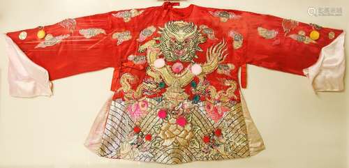 A scarlet-ground, Cantonese Bridal Jacket with a central high relief design of a Dragon beside cloud