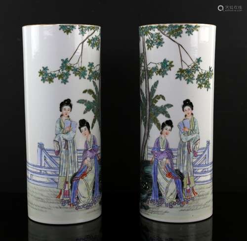 A pair of tall, famille rose brush pots or other vessels; each one of cylindrical form decorated