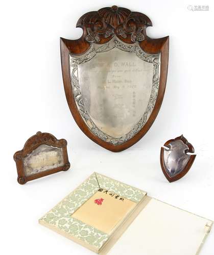 A Chinese white metal and hardwood presentation plaque, inscribed 'To Dr. A.D. Wall/A token of