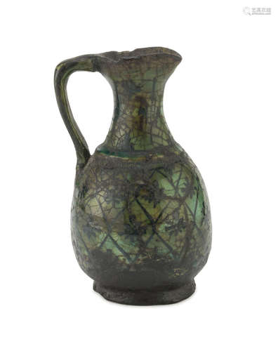 SMALL MAIOLICA JUG, PERSIA 19TH CENTURY in green enamel, with grid design and flowers. Measures