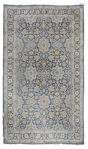 KIRMAN CARPET, EARLY 20TH CENTURY with design of small medallions and secondary motifs of shoots