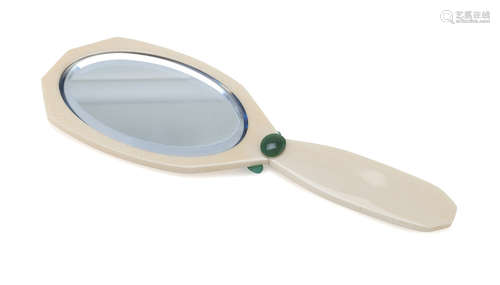 HAND MIRROR in bakelite of mixtilineal shape, with oval mirror and inserts in jadeite. Measures