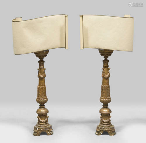 A PAIR OF GILTWOOD CANDLESTICKS, LATE 18TH CENTURY shaft sculpted to garlands and laurel leaves.