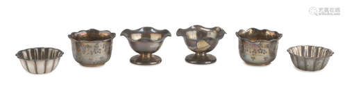 SIX SILVER EGG CUPS, UNITED KINGDOM EARLY 20TH CENTURY fluted bodies engraved with vegetal motifs.