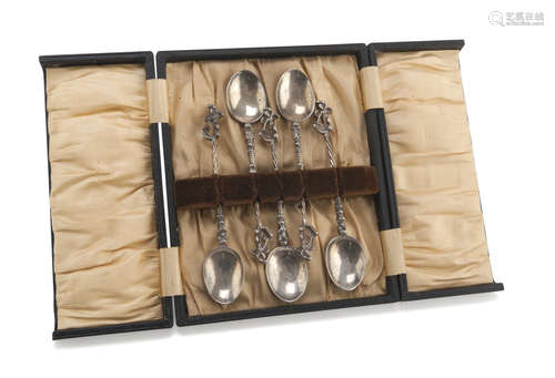 FIVE SILVER TEASPOONS, PUNCH LONDON 1892 with twisted handles, chiseled to Adamic figures.