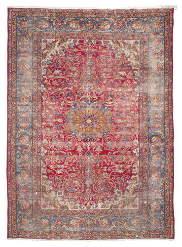 ISFAHAN CARPET, EARLY 20TH CENTURY with blue medallion and secondary motifs of twisted branches with