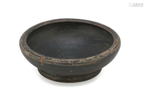 BLACK-GLAZED DISK, 4TH CENTURY B.C. in orange clays. Entire. Measures cm. 3 x 9. The find is