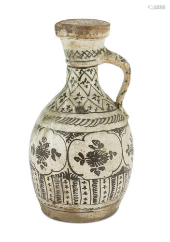 GLAZED CERAMIC PITCHER, PERSIA 20TH CENTURY decorated with floral motifs and stylized geometries.