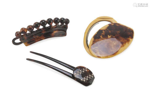 SMALL POCKET MIRROR AND TWO BARRETTES IN TURTLE, 20TH CENTURY one barrette with finishes in