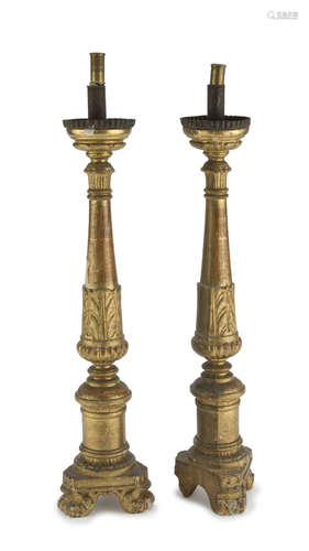 Pair of Giltwood candlesticks, 18TH CENTURY with sculpted shafts to leaves and pods. Measures cm. 70