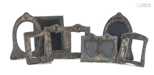 SEVEN SILVER-PLATED TABLE FRAMES, 20TH CENTURY of various shapes and decorations. Maximum size cm.