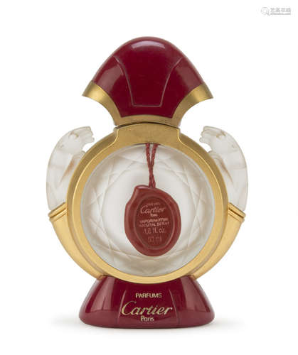 PERFUME BOTTLE IN OPALINES, CARTIER '80s with lions handles and finish in plastic and metal.