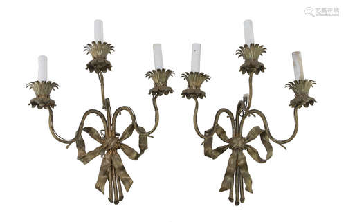 A PAIR OF APPLIQUES IN GILDED METAL, 20TH CENTURY with ramage arms to and petal sconces. Measures