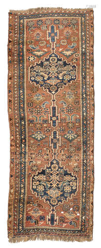 SHIRAZ RUNNER, EARLY 20TH CENTURY jagged medallions and secondary motifs of palmette, rosettes and