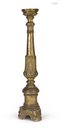 GILTWOOD CANDLESTICK, 18TH CENTURY shaft sculpted to palmette. Triangular base. h. cm. 91.