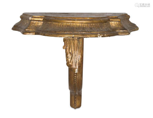 SMALL HANGING CONSOLE IN GILTWOOD, 18TH CENTURY with moved front and shaped leafy leg. Measures