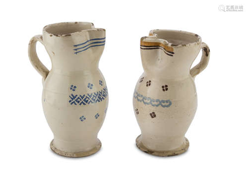 TWO CERAMIC PITCHERS, APULIA 19TH CENTURY in cream enamel decorated with flowers. Maximum size cm.