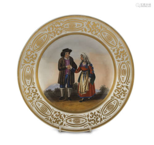 PORCELAIN DISH, 19TH CENTURY decorated with costumes of Chieti. Edge in gold with vegetal motifs.