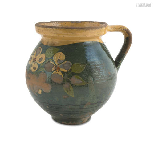 CERAMIC PITCHER, 19TH CENTURY in yellow and green enamel decorated with flowers. Measures cm. 16 x