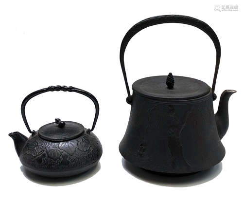 A Japanese iron Tetsubin (kettle), the body decorated with a tree and a leaping frog, signed,