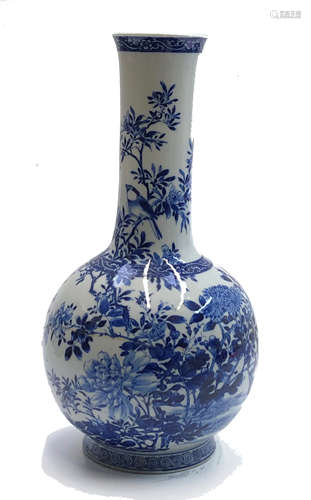 A Chinese blue and white porcelain bottle vase, the body with birds and a flowering tree,