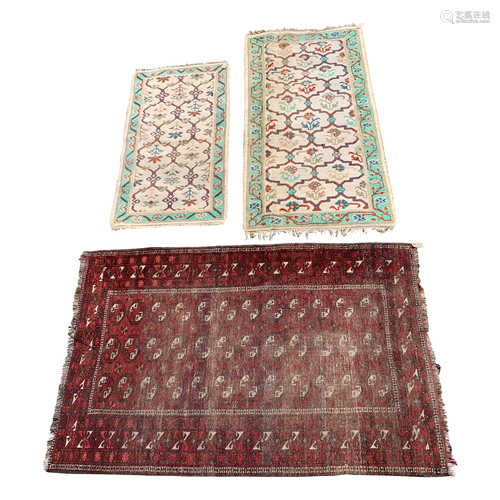 An Afghan rug, 200 x 126cm, and two Indian rugs, 183 x 94cm and 146 x 79cm.