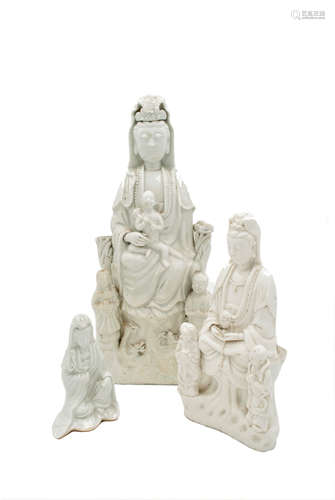 Three Chinese blanc de chine figures of Guanyin, heights 35cm, 23cm and 12.5cm.