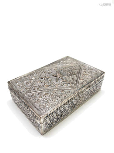 A Chinese repousse decorated cigarette box, the lid with birds perched in flowering branches,