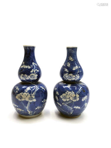 A pair of Chinese prunus pattern double gourd vases, late 19th century, height 16cm.