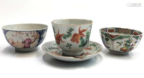 A Chinese famille rose tea bowl and saucer, 18th century, decorated with goldfish, red seal marks,