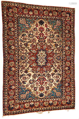 An Esfahan carpet, West Persia, the ivory field with a madder lobed pole medallion,